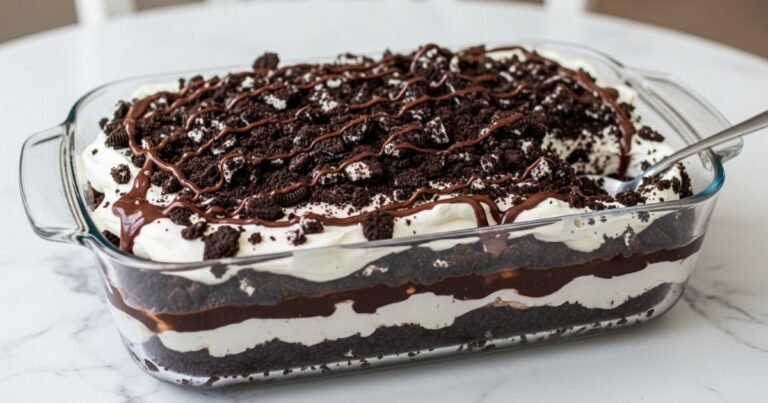 Finished Oreo dirt cake decorated with Oreo crumbs